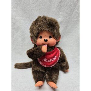 SEKIGUCHI  7.5" MONCHHICHI BOY WEARING RED BIB HOLDING PACIFIER DOLL